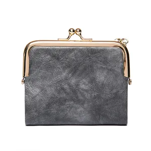 Vintage dark gray kiss-lock coin purse with metal frame and frosted leather texture