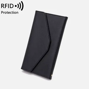 Minimalist black RFID blocking passport travel wallet with Saffiano texture and gold stud