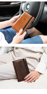 Close-up of leather passport holder with RFID protection and elastic strap detail