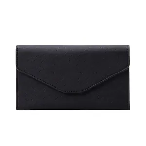 Minimalist black Saffiano RFID passport travel wallet with envelope flap on white background