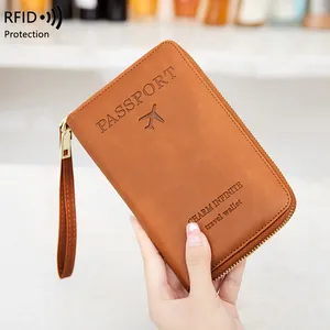 Vintage brown leather RFID passport travel wallet with gold zipper and hand strap