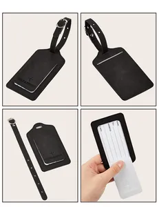 Detail of black PU leather luggage tag set with adjustable silver buckle strap and ID card