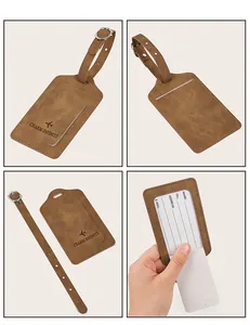 Detail view of brown PU leather luggage tag with adjustable buckle and info card