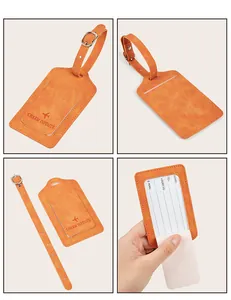 Detail of orange PU leather luggage tag with adjustable metal buckle and info card insert