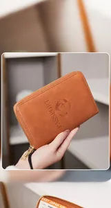 Detail of RFID blocking brown PU leather passport wallet with gold zipper and card slots