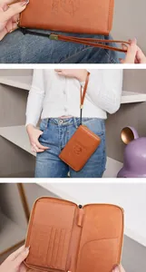 Brown leather RFID passport wallet with multi-card slots, SD holder, and wrist strap