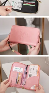 Detailed interior of pink RFID passport holder with multiple card slots and storage compartments