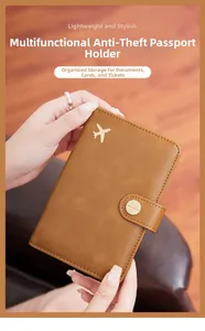 Brown leather RFID passport holder with airplane logo and secure snap button closure