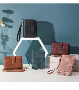 Detail view of retro oil wax leather RFID wallets in five colors with wrist straps