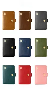 Grid view of RFID passport covers in nine colors with gold airplane emblem detail