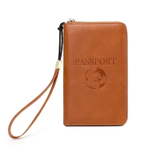 Brown RFID blocking travel passport wallet with zip closure and engraved world map icon