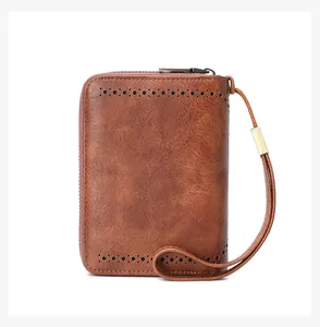 Detail of vintage brown leather wallet with RFID blocking and hollow-out perforation patterns