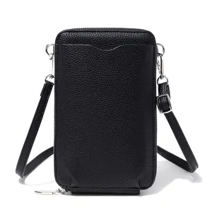 Petit sac bandoulière noir vertical en cuir grainé pour téléphone avec fermeture éclair argentée