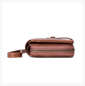 Detailed side view of brown oil wax leather wallet showing multi-layer organ structure