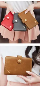 Detail view of RFID passport wallets with gold plane logo in red, grey, and brown colors
