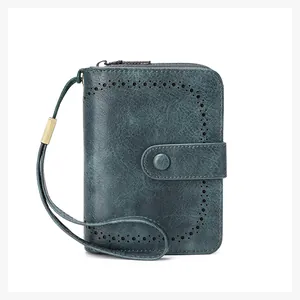 Detail of vintage oil wax leather wallet with RFID blocking and secure wrist strap