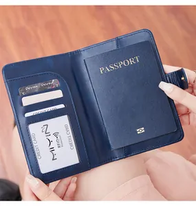 Detail view of RFID blocking passport holder with card slots and snap closure