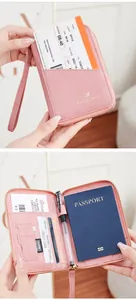 Detail of pink RFID passport wallet showing interior card slots and SD card pocket