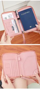 Pink RFID travel passport wallet with multiple slots for cards, SD cards and pen holder