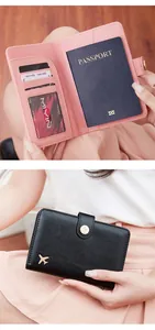 Detail of RFID blocking passport holder showing interior card slots and aircraft logo