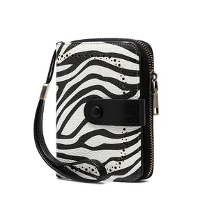 Detail of zebra pattern wallet with lychee leather texture and RFID protection feature