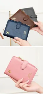 Multi-fold RFID travel wallet with gold airplane logo in four elegant color options