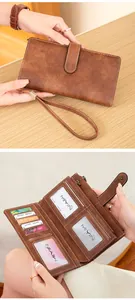Detailed view of brown RFID leather wallet showing card slots and zipper pocket