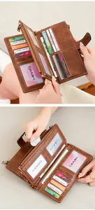 Detail view of the interior slots, zipper pocket, and RFID lining of the retro brown wallet