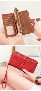 Detail of RFID blocking long wallet showing interior card slots and zipper compartment