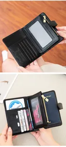 Detail of RFID blocking black leather travel wallet with passport slot and card holders