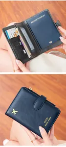Detail view of RFID travel wallet showing interior passport slots and aircraft logo