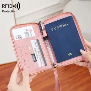 Pink RFID blocking travel passport wallet with multi-functional card slots and zipper