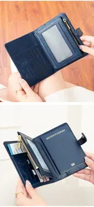 Detail view of navy blue RFID passport holder with multiple card slots and SD card pocket