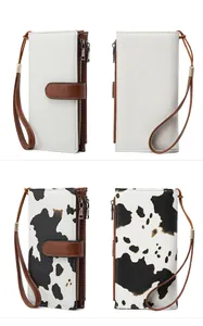 Detail of RFID-blocking long wallets in cow print and beige with wristlet straps
