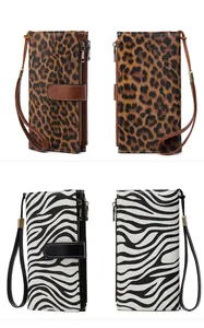 Detail view of RFID long wallets in leopard and zebra print with wristlet and zip pocket