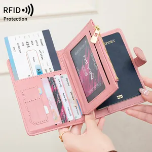 Pink RFID blocking passport holder with multi-card slots and portable travel organizer