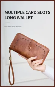 Detail view of brown vintage long wallet with multiple card slots and wristlet strap