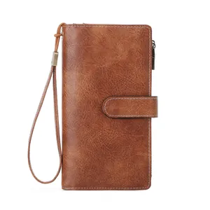 Retro RFID blocking long trifold wallet for women in brown leather with wristlet strap