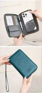 Detail view of RFID travel wallet with compartments for passport, SIM cards and phone