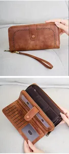 Detail view of RFID blocking vintage leather wallet with multi-slots and cut-out pattern