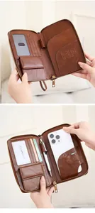 Detailed interior of a brown leather RFID passport wallet with card slots and phone pocket