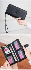 Detail of black faux leather RFID wallet featuring heart hollow pattern and multi-card slots