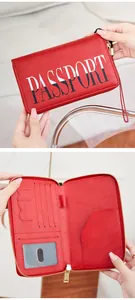 Macro detail of red RFID passport wallet with gold zipper and multi-slot interior