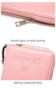 Detail of pink RFID leather passport holder showing smooth metal zipper and embossed texture