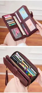 Detail of burgundy RFID leather wallet featuring multiple card slots and zip pocket