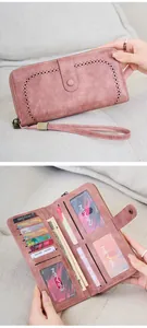 Detail view of pink RFID long wallet with laser-cut pattern and multi-card slot storage
