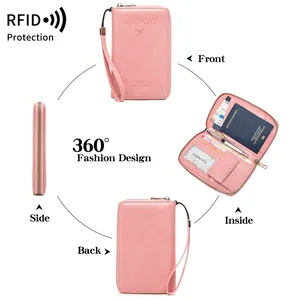 Pink RFID blocking passport holder travel wallet with multi-card slots and wrist strap