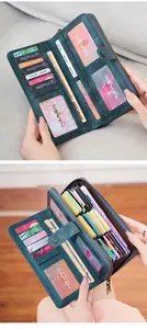 Detail view of large capacity RFID long wallet featuring multiple card slots and leather texture