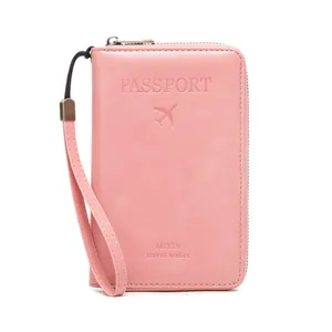 Pink RFID blocking passport travel wallet with zipper closure and wrist strap