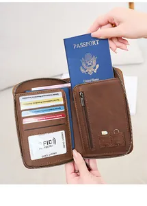 Detail of brown RFID leather passport holder with multi-card slots and SIM card storage